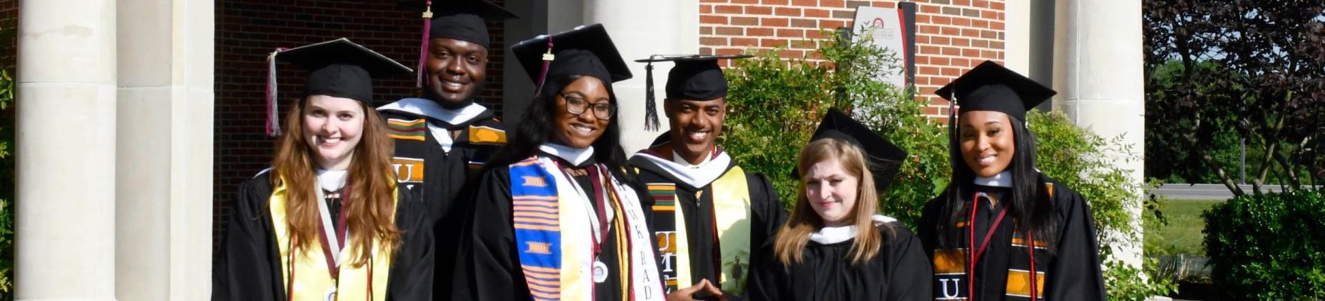 UMES students smile in their graduation robes