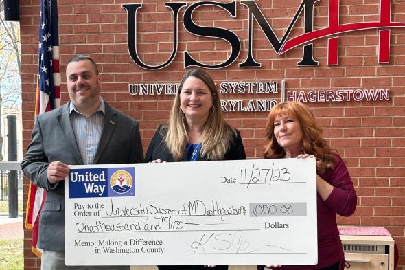 United Way of Washington County presents a $1,000 check from the United Against Hunger Grant to University System of Maryland at Hagerstown